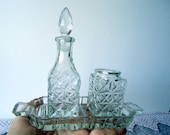 Crystal set for cooking tough dishes with seasonings, with bottles of vinegar, mustard and a suitable tray.
