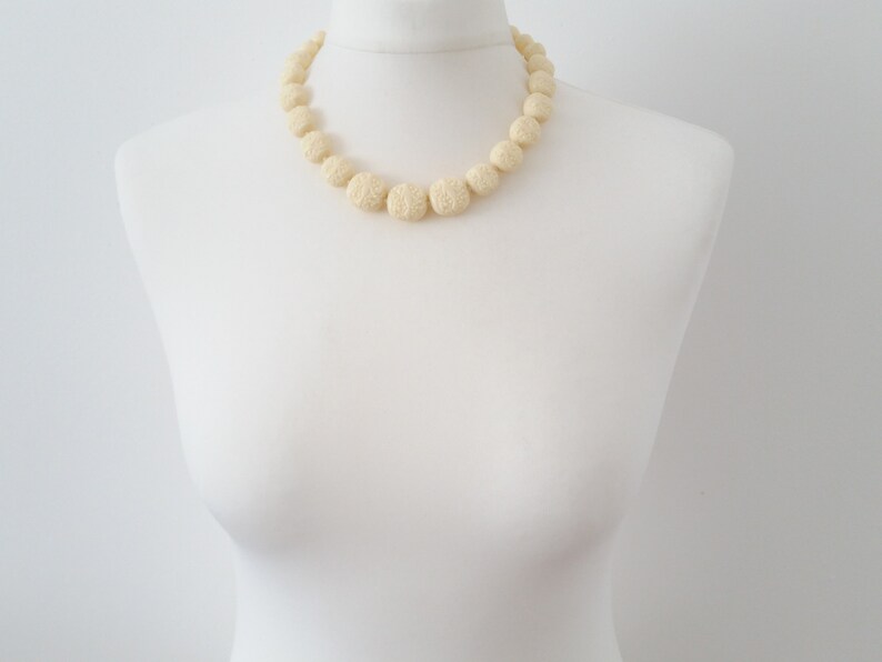 Faux ivory celluloid necklace unusual carved style moulded early plastic graduated bead necklace