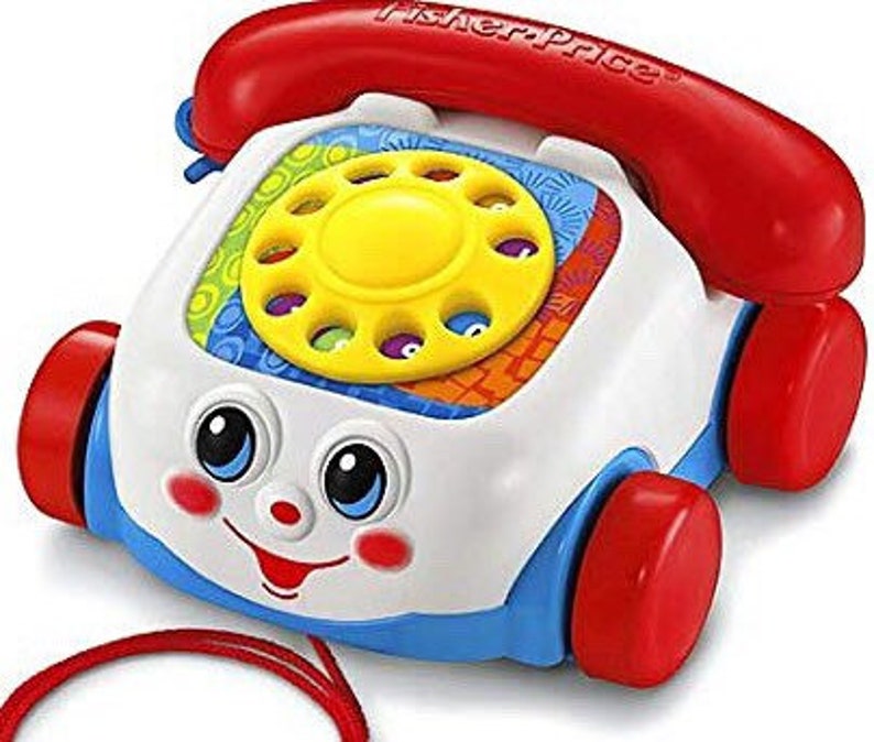 old toy phone with eyes