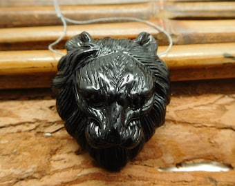 Tête de lion noire.  Lion d’obsidienne. Fabrication d’accessoires Lion Beads. Pendentif en pierres précieuses naturelles. Pendentif Totem Cadeau. Sculpter la tête de lion.