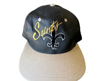 Vintage 90’s Twill NFL New Orleans Saints Black on Gold Cursive Embroidered Green Underbill Snapback Hat by Team NFL