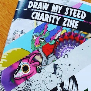 May include: A vibrant zine cover with the title "DRAW MY STEED CHARITY ZINE". The design is a collage of illustrations, including a pink skull, a green monster, and abstract shapes in blue, purple, and white.