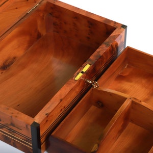 Interior shot of a handmade thuya wooden box with a removable upper tray divided into three sections