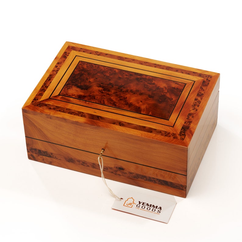 shot of thuya wood jewelry box by yemma goods from overhead featuring thuya burl veneer and cedar wood, handmade in morocco