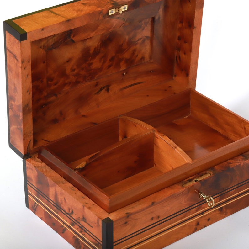Side view of an open thuya wooden jewelry box, showcasing the spacious compartments for storing jewelry and other keepsakes