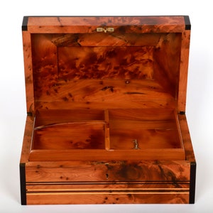 Open thuya wooden jewelry box with a divided upper tray featuring three compartments