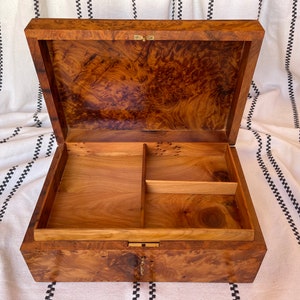 open thuya wood keepsakes box made of thuya burl veneer showcasing intricate burl grain patterns, the box is lockable with various compartments for easy organization