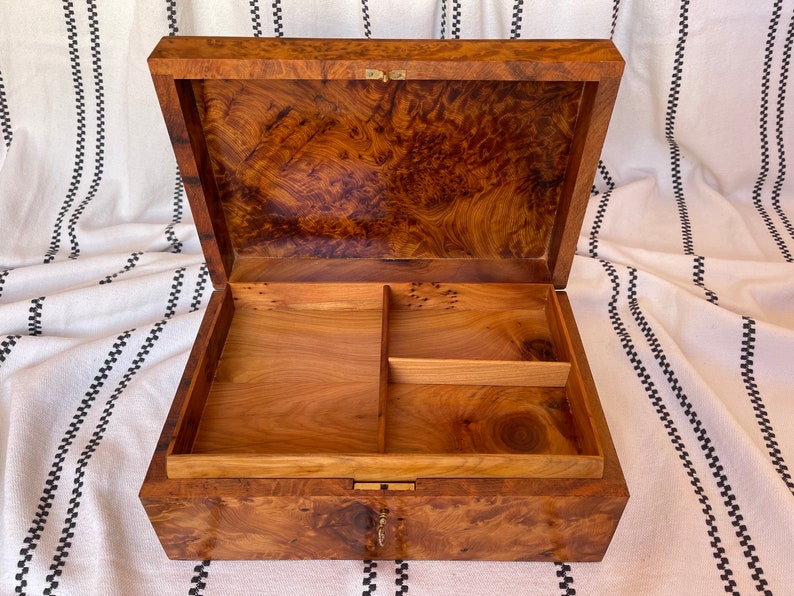 open thuya wood keepsakes box made of thuya burl veneer showcasing intricate burl grain patterns, the box is lockable with various compartments for easy organization