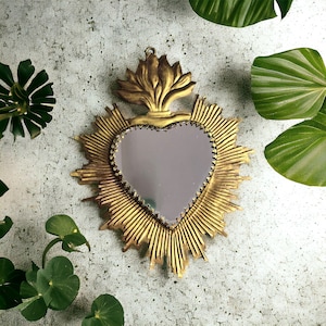 Elevate your space with our Mirror featuring a Burning Heart in Gold-Plated Metal