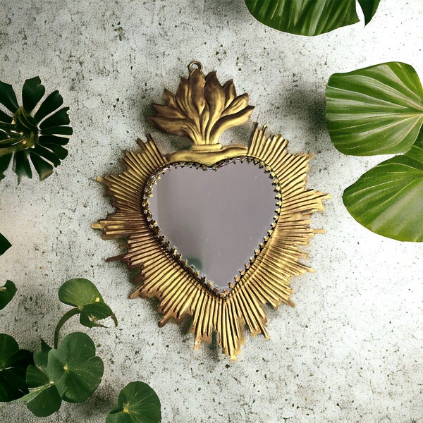 Elevate your space with our Mirror featuring a Burning Heart in Gold-Plated Metal