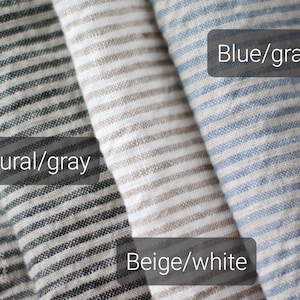 A color guide infographic showing three striped linen fabric options side by side. Text overlays label each style: 'Natural/gray' for the dark charcoal and white thin stripes, 'Beige/white' for the natural tan and white stripes, and 'Blue/gray' for the light blue and muted gray striped pattern.