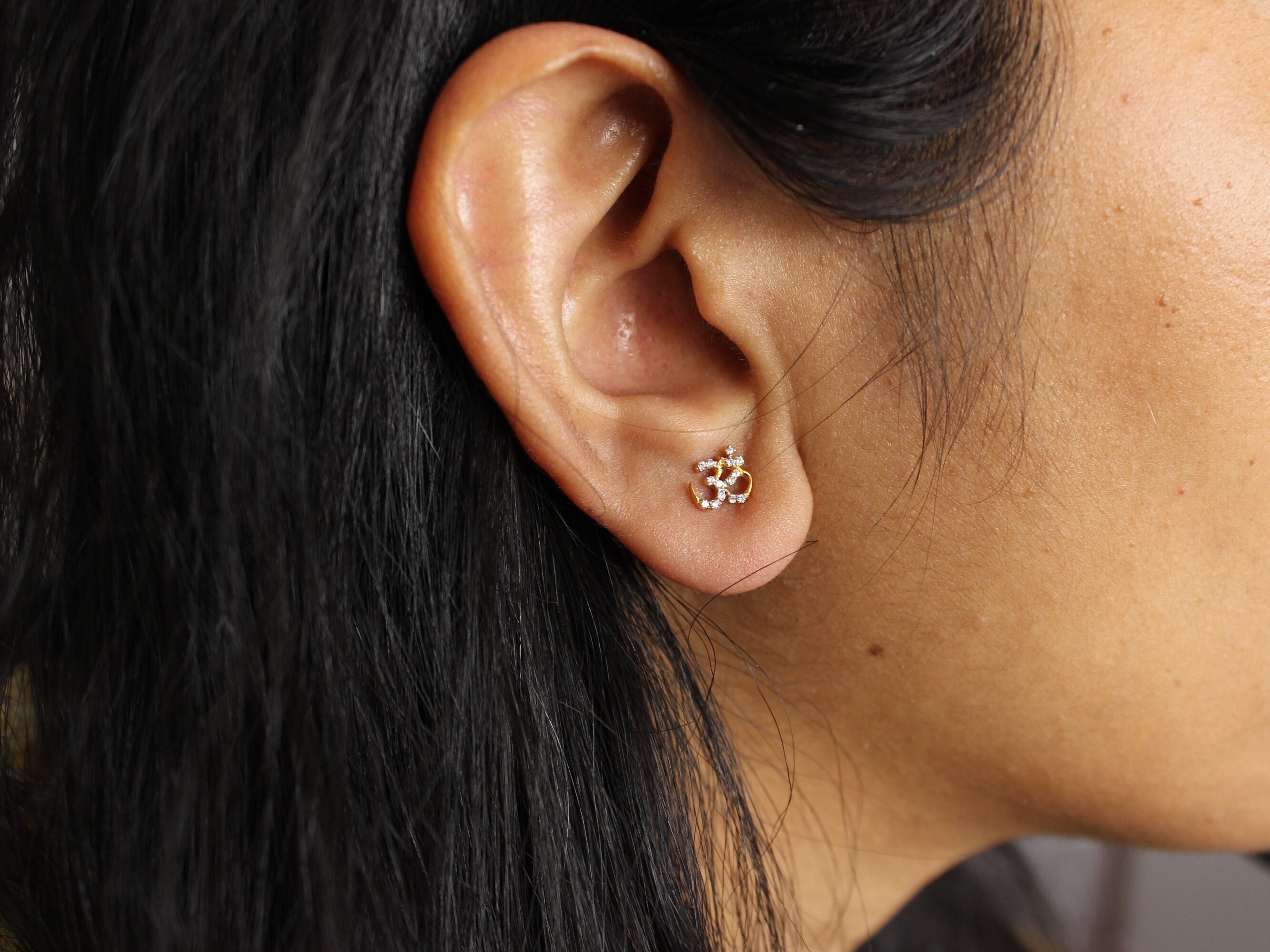 Gold om stud earrings best sale