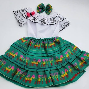 Butterfly embroidered outfit. White top with Butterfly embroidery design and Skirt outfit. White top with Black Butterfly Embroidery.