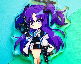 May include: A purple-haired anime character with a halo, holding two guns, is featured on a clear acrylic keychain. The keychain has a gold chain and a silver clasp. The character is wearing a white jacket with blue accents and a black skirt. The text "#エイチ" is printed on the keychain.