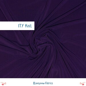 May include: A deep purple ITY knit fabric featuring a smooth, matte texture with natural folds and drapes. A white rectangular overlay in the upper left corner displays the text ITY Knit, while the bottom center features Riverview Fabrics.