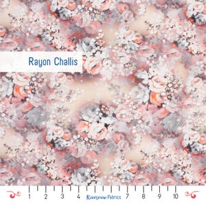May include: Rayon Challis fabric featuring a dense floral pattern with clusters of roses and small blossoms in shades of soft peach, muted grey, and white against a light cream background. A ruler at the bottom shows a 10-inch scale.
