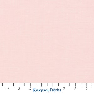 May include: A close-up of a light pink fabric with a subtle textured weave. The fabric is evenly lit, showing a consistent color and texture across the surface. The text "Riverview Fabrics" is visible at the bottom.