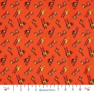 May include: Orange fabric with a repeating pattern of yellow and black fire trucks and ladders. The fire trucks have red and gray accents. The text "Riverview Fabrics" is printed at the bottom.