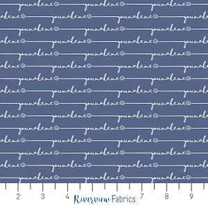 May include: A blue fabric with a white repeating pattern of the phrase "you make me" with a smiley face at the end of each phrase. The fabric is measured with a ruler in inches.