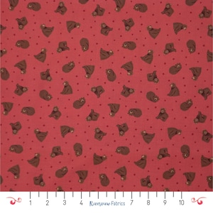 May include: Red fabric with a repeating pattern of brown bears in various poses and small red dots. The bears are in different positions, some sitting, some standing, and some upside down. The fabric has a playful and whimsical design.