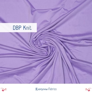 May include: A close-up of a swirl of lavender DBP Knit fabric. The fabric is smooth and has a slight sheen. The text "DBP Knit" is displayed on a white rectangle. The Riverview Fabrics logo is at the bottom.