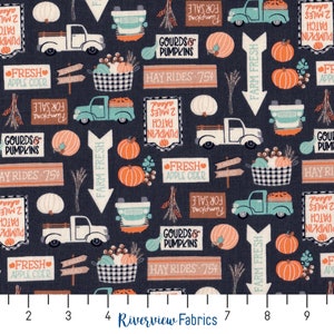 May include: A dark blue fabric with a repeating pattern of autumn-themed illustrations. The pattern includes pumpkins, gourds, hayrides, farm fresh signs, and trucks. The text on the signs reads "Pumpkin Patch 2 Miles", "Gourds & Pumpkins", "Hay Rides 75p", and "Fresh Apple Cider".