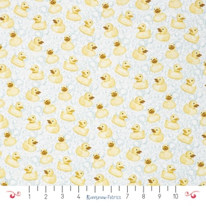 May include: A fabric pattern featuring numerous yellow rubber duck illustrations on a light blue background with bubble accents. The ducks are facing various directions, creating a playful and whimsical design. The text "Riverview Fabrics" is visible at the bottom.