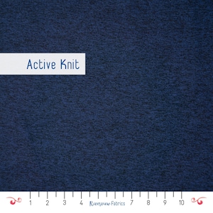 May include: Close-up of a textured navy blue fabric. The fabric has a slightly mottled appearance. The words "Active Knit" are displayed on a white rectangular label. A ruler is at the bottom of the image.