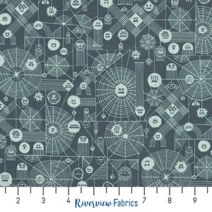 May include: A blue fabric with a white pattern of spiderwebs, geometric shapes, and smiling faces. The fabric has a ruler with inches marked on it.