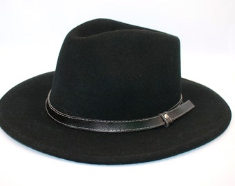May include: A black fedora hat with a wide brim and a leather band around the crown.