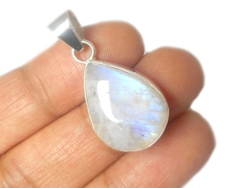 May include: A silver pendant with a teardrop-shaped moonstone. The stone is iridescent and has a white and blue color.