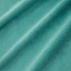 May include: A close-up of a soft, teal-colored fabric with a smooth, velvety texture. The fabric is folded in a way that shows its drape and texture.