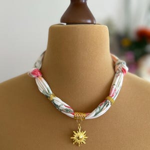 Necklace / fabric necklace / chain with charms golden sun