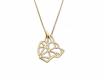 May include: A gold necklace with a geometric dog pendant. The pendant is made of thin metal and has a detailed design.