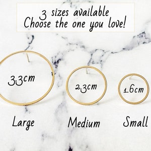 May include: Three gold hoop earrings in different sizes: 3.3 cm, 2.3 cm, and 1.6 cm. The earrings are labeled "Large", "Medium", and "Small".