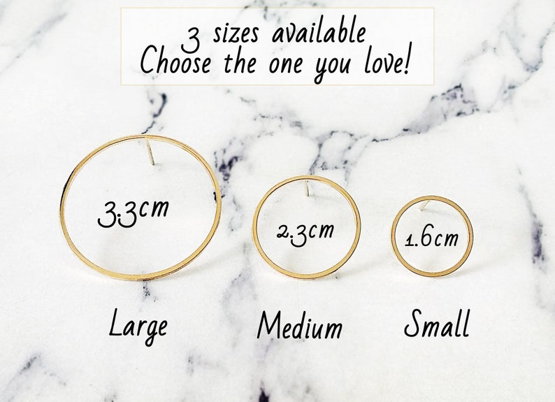 May include: Three gold hoop earrings in different sizes: 3.3 cm, 2.3 cm, and 1.6 cm. The earrings are labeled "Large", "Medium", and "Small".
