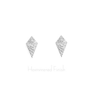 May include: A pair of silver diamond-shaped earrings with a hammered finish.