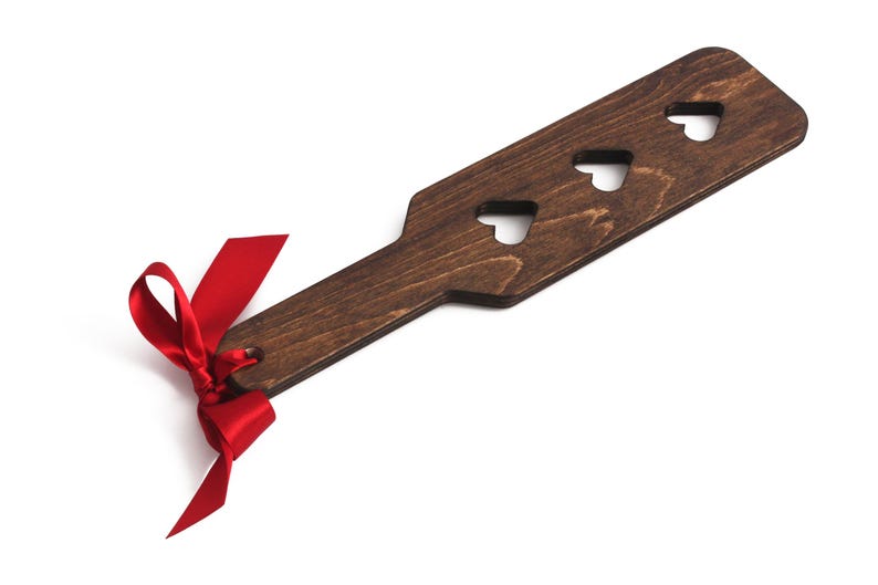 wooden spanking paddle with hearts cut out