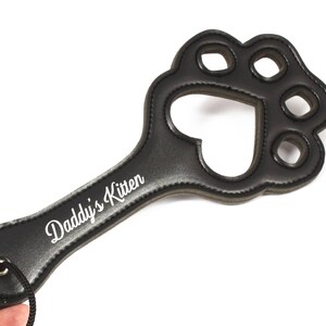 Showing the detail of the Daddy's Kitten Pet Play paw paddle