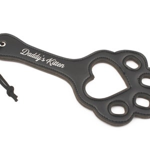 Paw shaped spanking paddle made of faux leather
