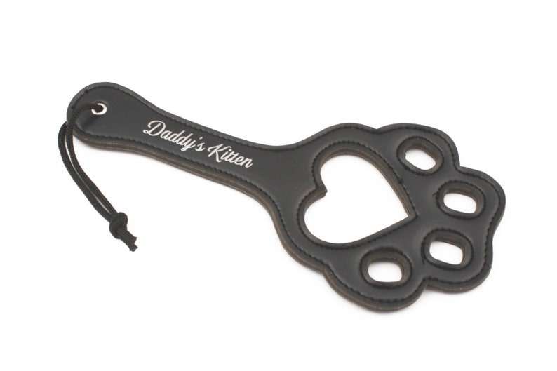 Paw shaped spanking paddle made of faux leather