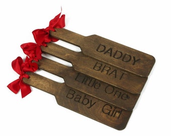 Custom Bdsm spanking paddles. Engraved paddle with DDLG words and phrases. The ideal gift for a daddy dom or anyone with a spanking fetish