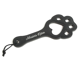 Masters kitten floggger. Faux leather paw print black custom spanking flogger. Pet play toys for kittens and littles and masters property