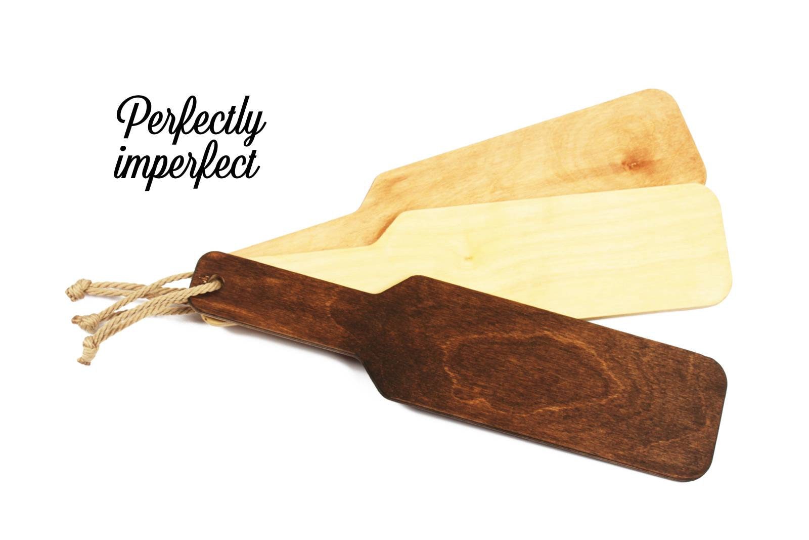 Perfectly imperfect wooden spanking paddle. Available in three different wood stains. Spanking paddles for BDSm play.