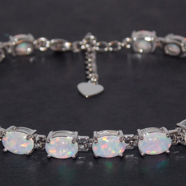 Silver Fire Opal Oval Cut 24.02ct Tennis Bracelet (925)