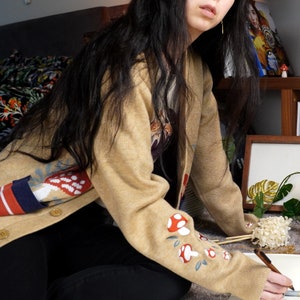 Agaric Garden Knitted and Embroidered Cardigan | Beige Cottagecore and Mushroomcore Fungi Motifs with Unisex Sizing and Double Pockets