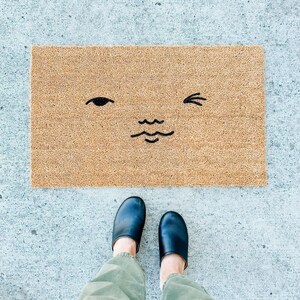 wink face doormat . welcome mat . gift for her . coir mat . custom door mat . funny doormat . housewarming gift . funny gift . wedding gift
