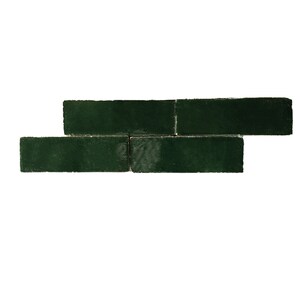 May include: Three dark green ceramic tiles arranged in a staggered pattern. The tiles are rectangular and have a slightly textured surface.