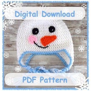 May include: A crochet pattern for a snowman hat with a white hat, blue and white trim, and a carrot nose. The pattern is a digital download and is available as a PDF.