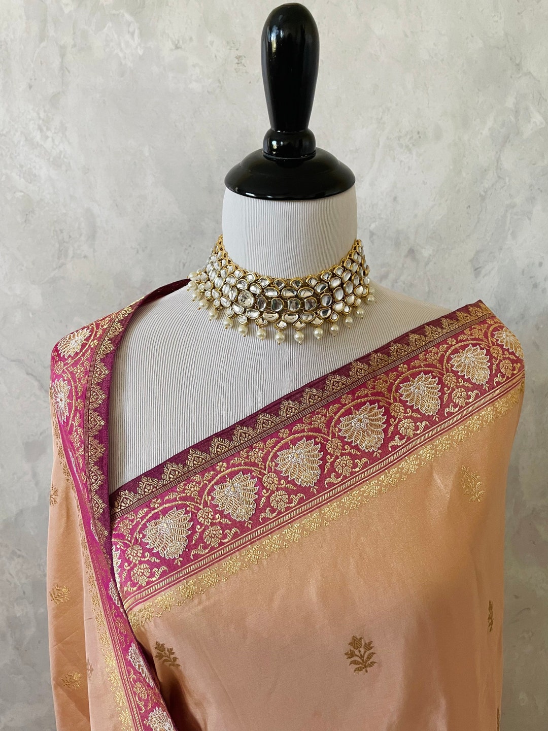 Women’s Banarasi katan tissue silk saree with heavy lace border and rich pallu, pink and gold